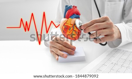 Foto stock: Cardiologist Examining Cardiogram