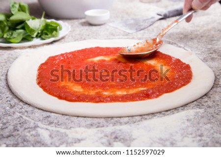 Stock fotó: Spreading Pizza Sauce