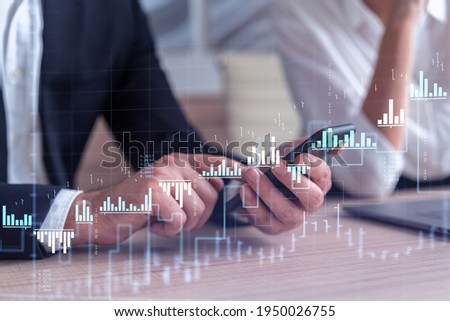 Zdjęcia stock: Woman Reading Graph Chart And Working With Laptop At Bar Counter