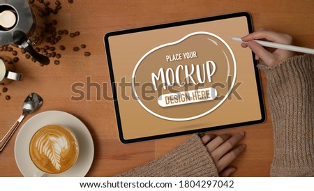 [[stock_photo]]: Overhead View Of Digital Tablet By Breakfast And Potted Plant