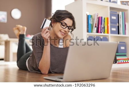 ストックフォト: Woman Doing Online Shopping With A Credit Card On Laptop