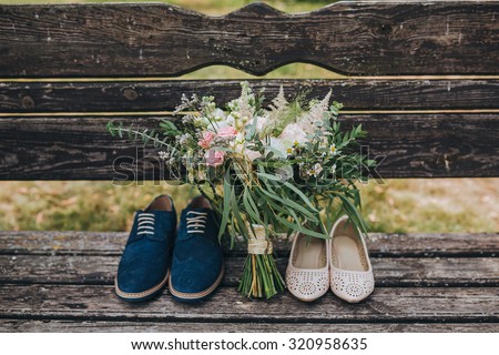 Stockfoto: Wedding Shoes Of The Bride With A Bouquet Of Peonies And Other Flowers