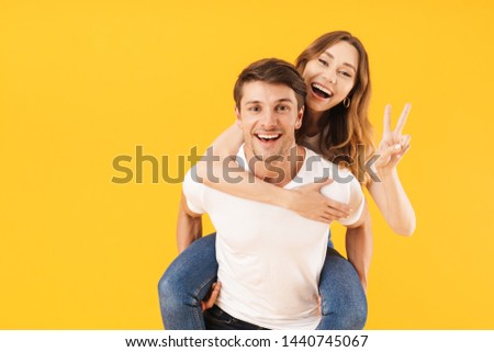 Stok fotoğraf: Portrait Of Young Pleased Woman Gesturing Peace Sign And Smiling