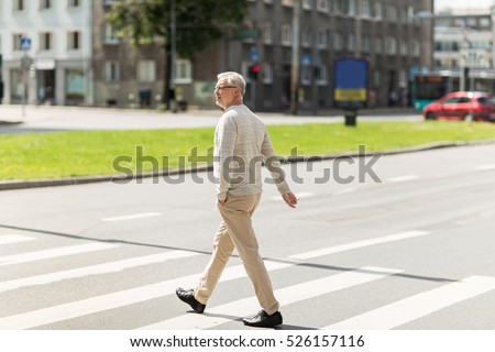 Zdjęcia stock: Senior Man Walking Along City Crosswalk