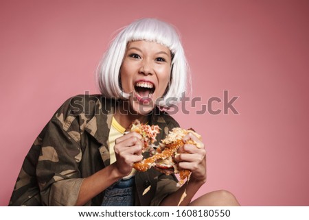 Сток-фото: Image Of Wild Asian Girl Screaming And Tearing Big Burger Apart