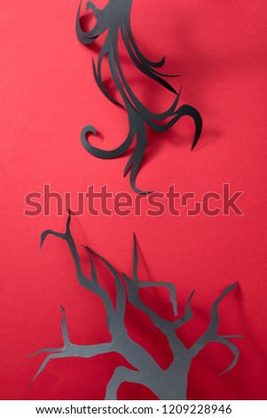 Stockfoto: Creative Scary Card From Paper Handcraft Trees On A Red Background With Space For Text Halloween La