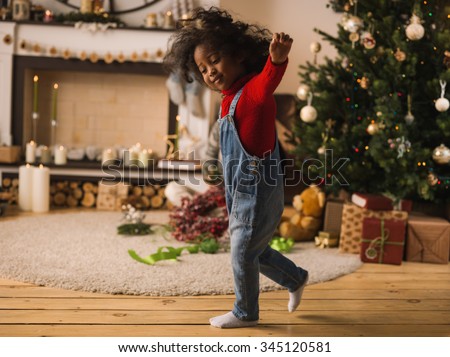 ストックフォト: Cute Mixed Race Young Baby Girl Having Fun With Christmas Hat An