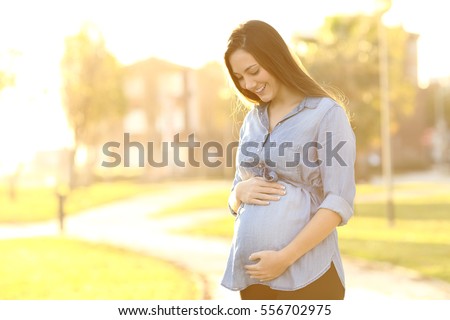 Zdjęcia stock: Portrait Of A Happy And Proud Pregnant Woman On Urban Background