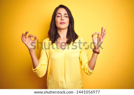 Stock photo: Beautiful Woman Isolated Over Blue Background Meditate