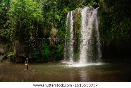 Stock photo: Woman Traveler On A Waterfall Background Ecotourism Concept