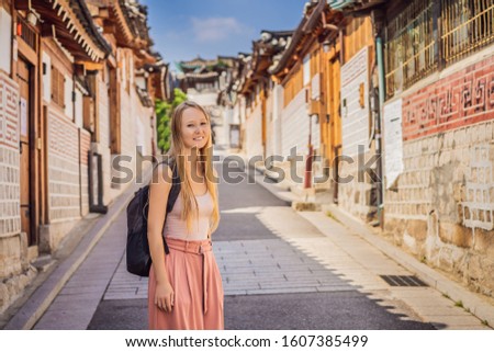 Сток-фото: Young Woman Tourist In Bukchon Hanok Village Is One Of The Famous Place For Korean Traditional House