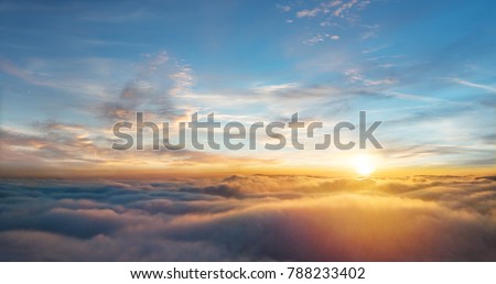 Airplane View Of Clouds Ocean And Bright Sun [[stock_photo]] © Jag_cz