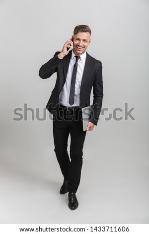 [[stock_photo]]: Handsome Businessman Talking On The Phone Over White Background