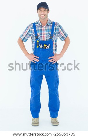 Foto stock: Handyman In Coveralls Standing Hands On Hip Over White Backgroun