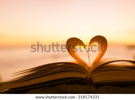 Stok fotoğraf: Symbol Of Love On Page Book