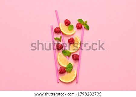 Stok fotoğraf: Ripe Raspberry And Lemon Slices Pattern Of Fruit On A Blue Background Food Layout Flat Lay