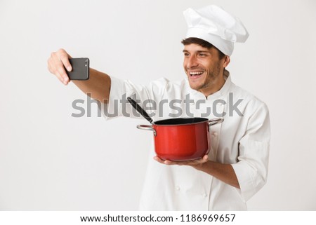 [[stock_photo]]: Chef Man Isolated Over White Wall Background Take A Selfie By Mobile Phone
