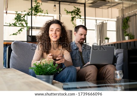 [[stock_photo]]: Young Couple Sitting At The Table And Working Together Of Creati