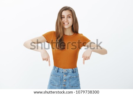 Zdjęcia stock: Good Looking Woman Pointing At The Camera While Standing Against A White Background