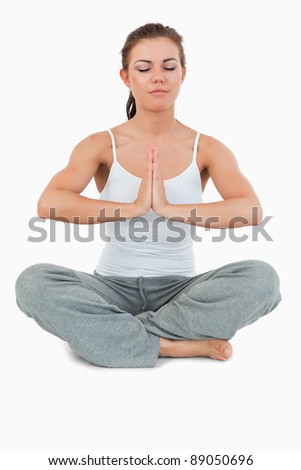 Stockfoto: Portrait Of A Woman In The Sukhasana Position Against A White Background