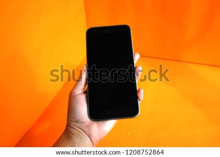 Foto stock: Hand Holding Phone With Empty Cloud