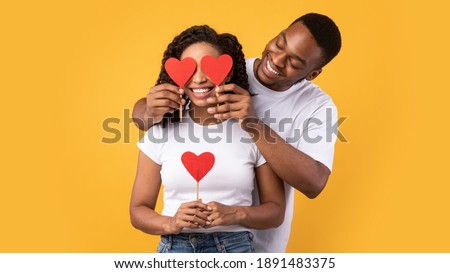 Foto stock: Image Of Two Lovely Women Smiling And Holding Banner With Copysp