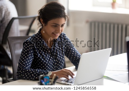 [[stock_photo]]: Young Successful Female Entrepreneur Prepares Report For Startup Project Searches Information On La