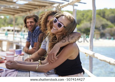 Stock photo: Side View Of Romantic Happy Multi Ethnic Couple Looking At Each Other Between Beach Huts On Sunny Da