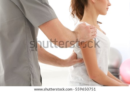 Stock photo: Physiotherapist Working With Patient Doing With Exercise Physic