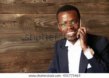 Foto stock: Portrait Of A Businessman Making A Phone Call Against A White Background