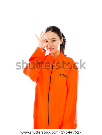 Foto stock: Young Asian Woman Showing Ok Sign In Prisoners Uniform