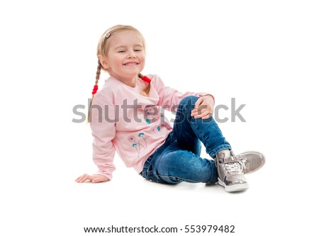 Сток-фото: Cute Funny Small Smiling Girl Sitting In Studio Posing On White Background