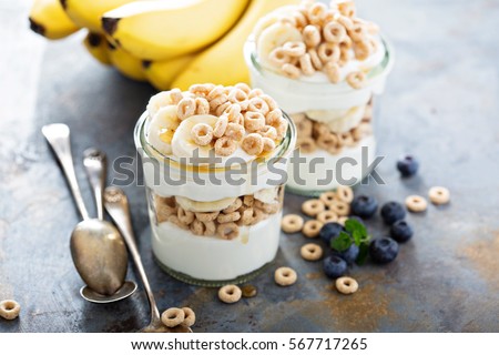 [[stock_photo]]: Oat Granola With Fresh Blueberries Banana Yogurt And Maple Syr