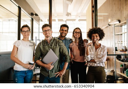 Foto stock: Portrait Of Successful Creative Business Team Looking At Camera