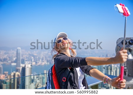 Stock photo: Hong Kong Victoria Peak Woman Taking Selfie Stick Picture Photo With Smartphone Enjoying View Over V