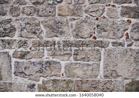Foto stock: Stone Wall With Abstract Pattern