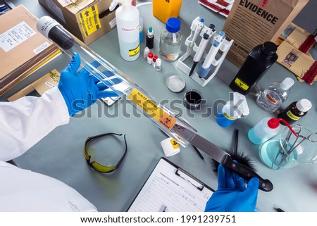 Stock photo: Bloody Fingerprint As Evidence In Forensic Crime Investigation