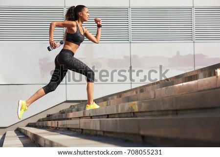 Foto stock: Urban Fitness Women Running And Climbing Stairs