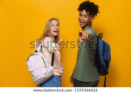 Foto stock: Photo Of Multiethnic Students Man And Woman 16 18 Wearing Backpa