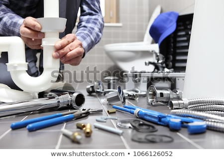 Stockfoto: Plumber Fixing A Siphon