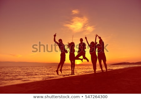 Stok fotoğraf: Beach With People Silhouette