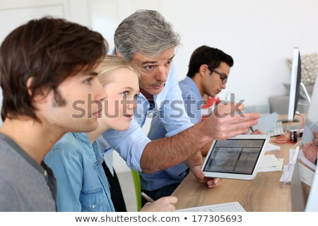 [[stock_photo]]: Young Boy Working With Pda