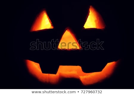 Foto d'archivio: Spooky Halloween Red Background With Jack O Lantern