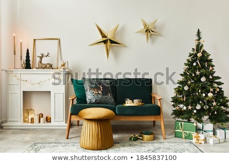 Foto stock: Christmas Home Decoration With Lights On White Wooden Background