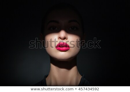 Stok fotoğraf: Attractive Model With Pink Lips And Shadow Casting On Face