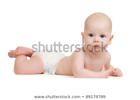 ストックフォト: Cute Pretty Baby Boy In Diaper Lies On Tummy