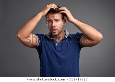 Сток-фото: Man Examining His Hair