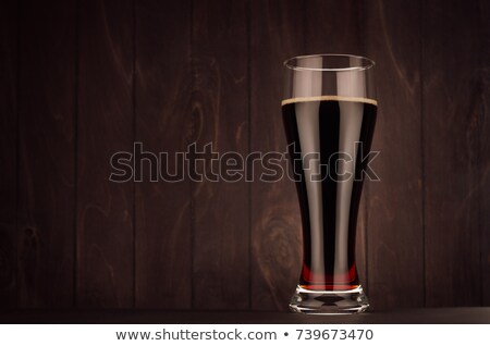 Foto stock: Weizen Beer Glass Porter Or Red Ale On Dark Wood Board Copy Space