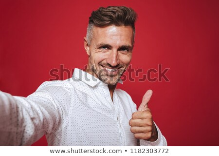 Zdjęcia stock: Masculine Serious Man 30s In White Shirt Taking Selfie Photo Is