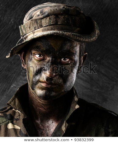 Foto stock: Armed Soldier With Damaged Wall Background